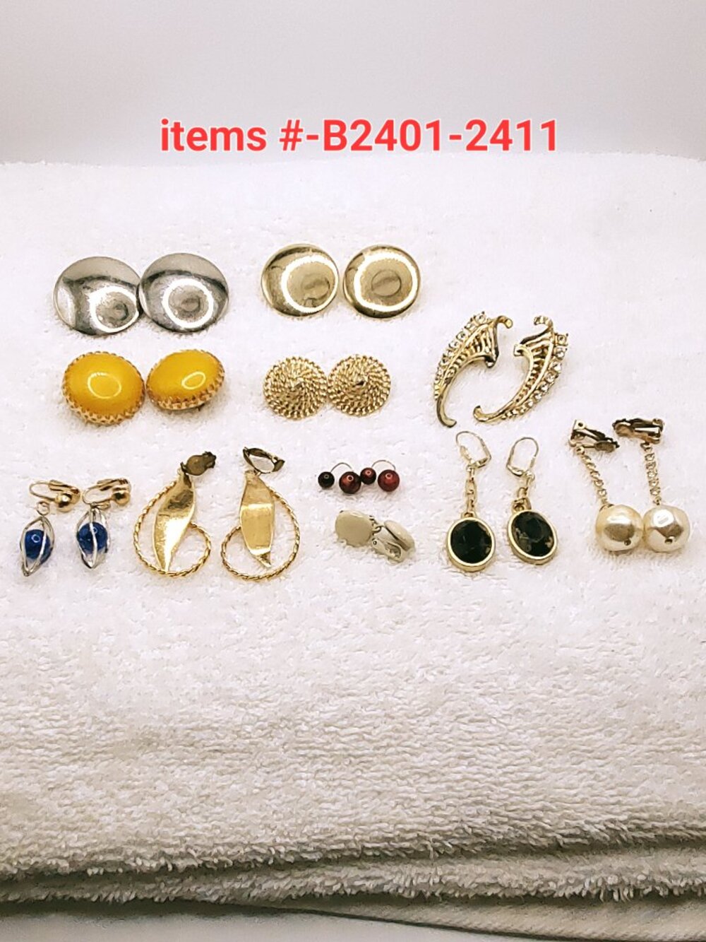 11 Pair of Clip on Earrings, items # B-2401-2411.,  wt. 122 grams.
